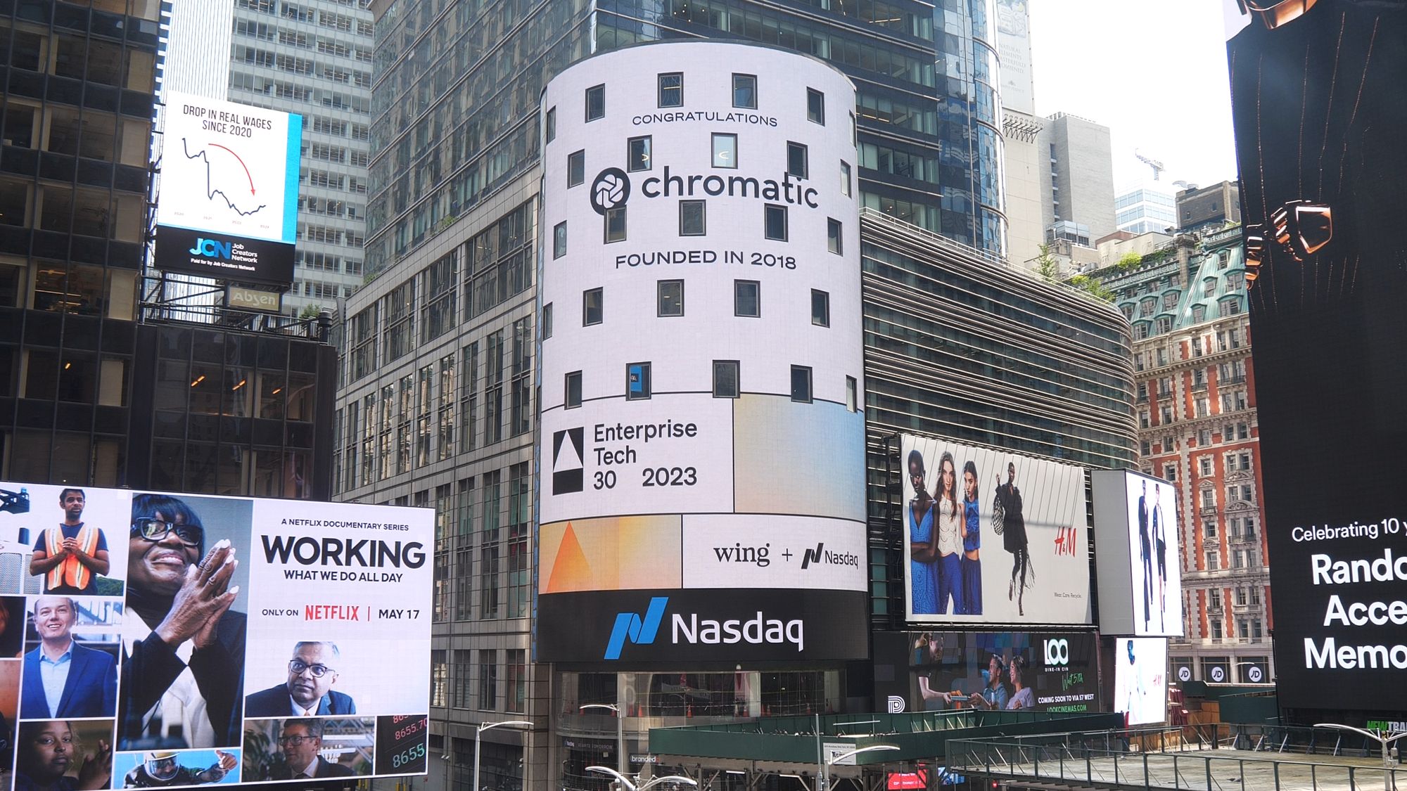 The Chromatic logo appears on the Nasdaq building in Times Square, New York. The text reads: 'Congratulations Chromatic, founded in 2018.'